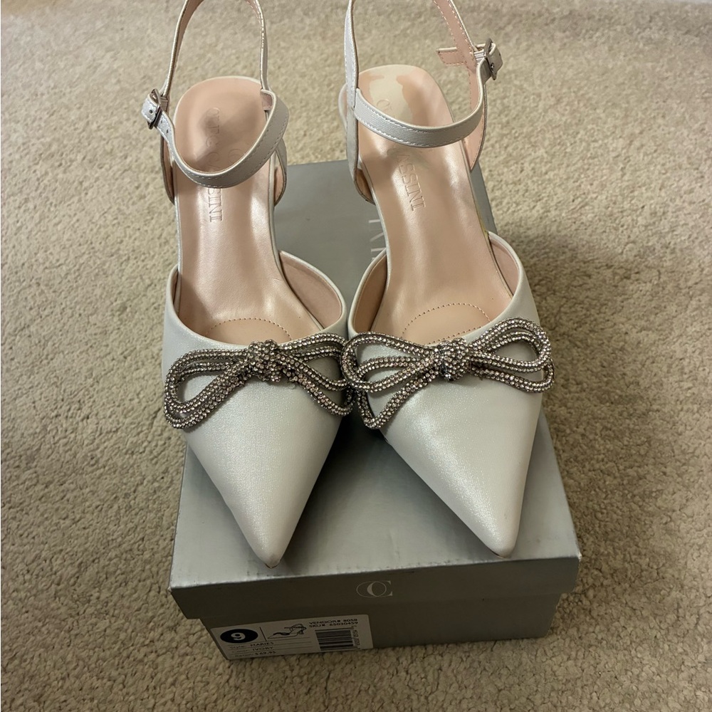 Elegant Ivory/Shimmer Slingback Heels with rhinestone Bow worn once